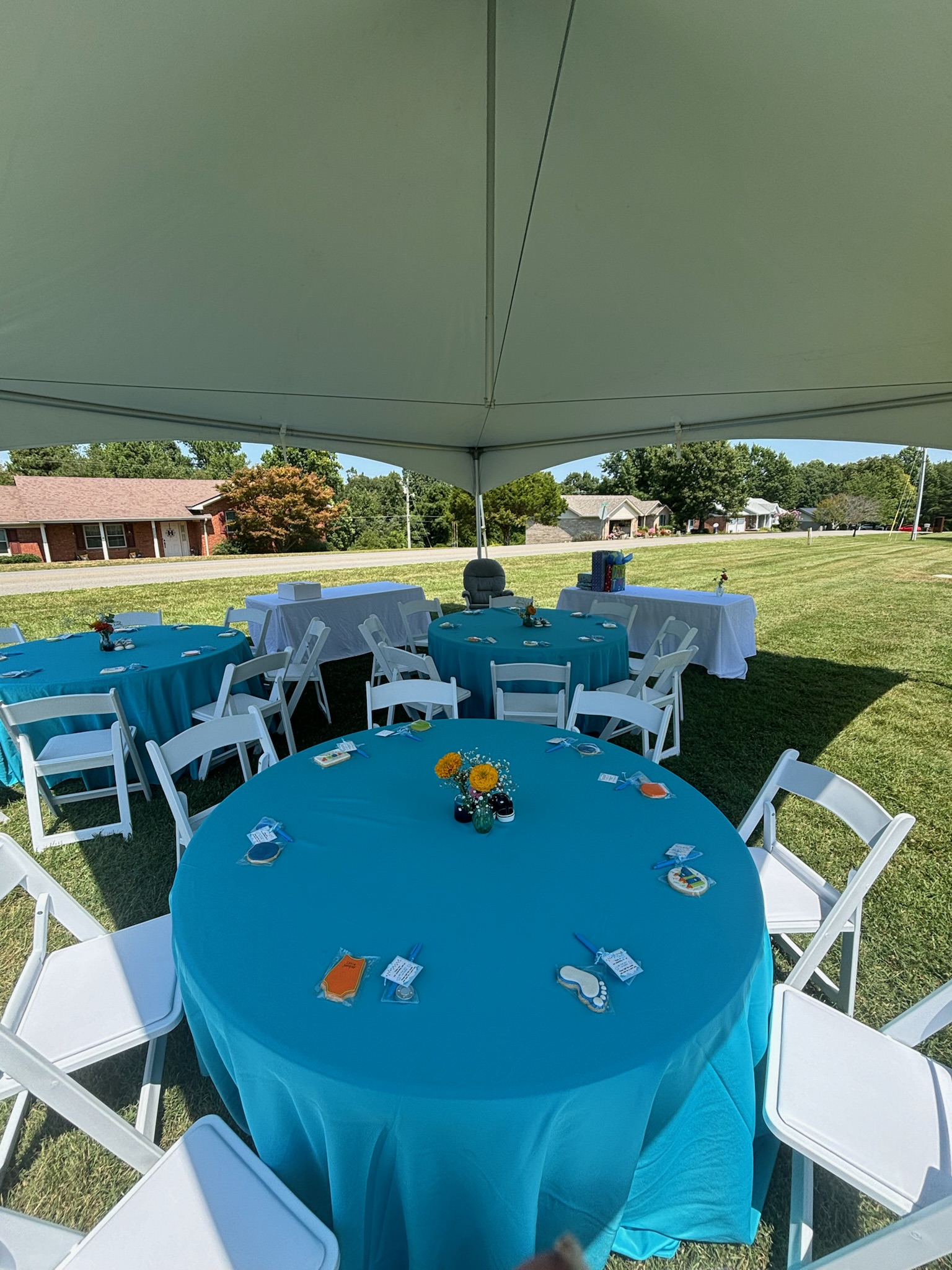 20x20 High Peak Tent, 60_ Round Tables, 6_ Rectangle Tables, White Resin Padded Folding Chairs, Linen, Decor